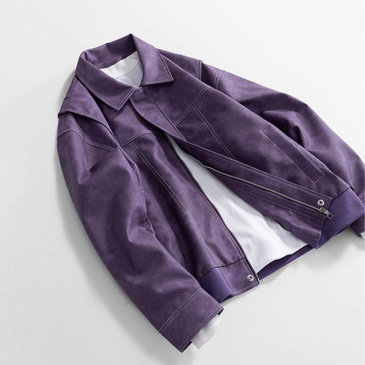 Purple leather jacket draped showing asymmetric zip closure