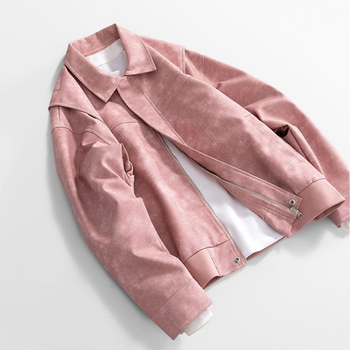 Dusty pink leather jacket draped showing zip and pocket detail