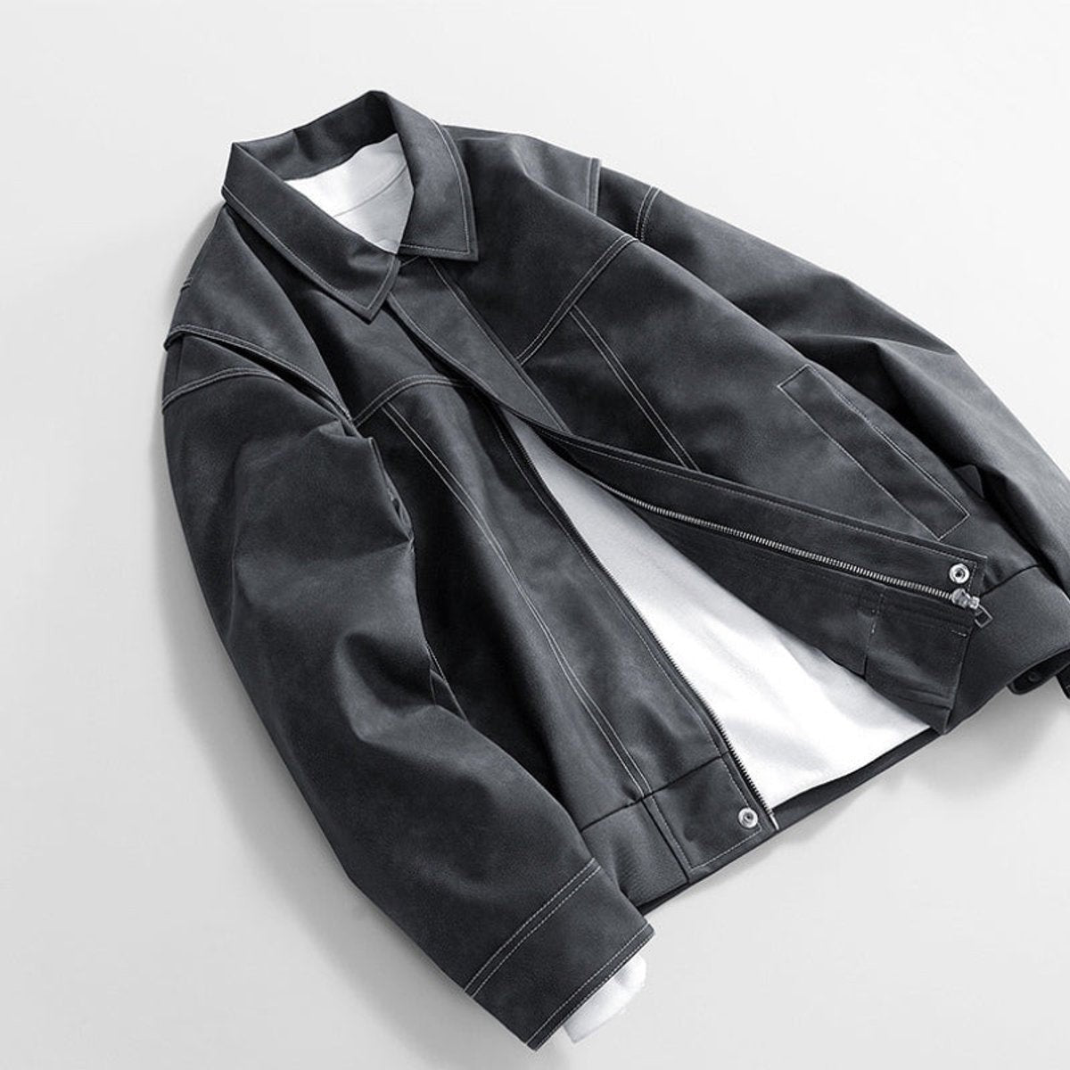 Charcoal grey leather jacket draped showing contrast topstitching detail