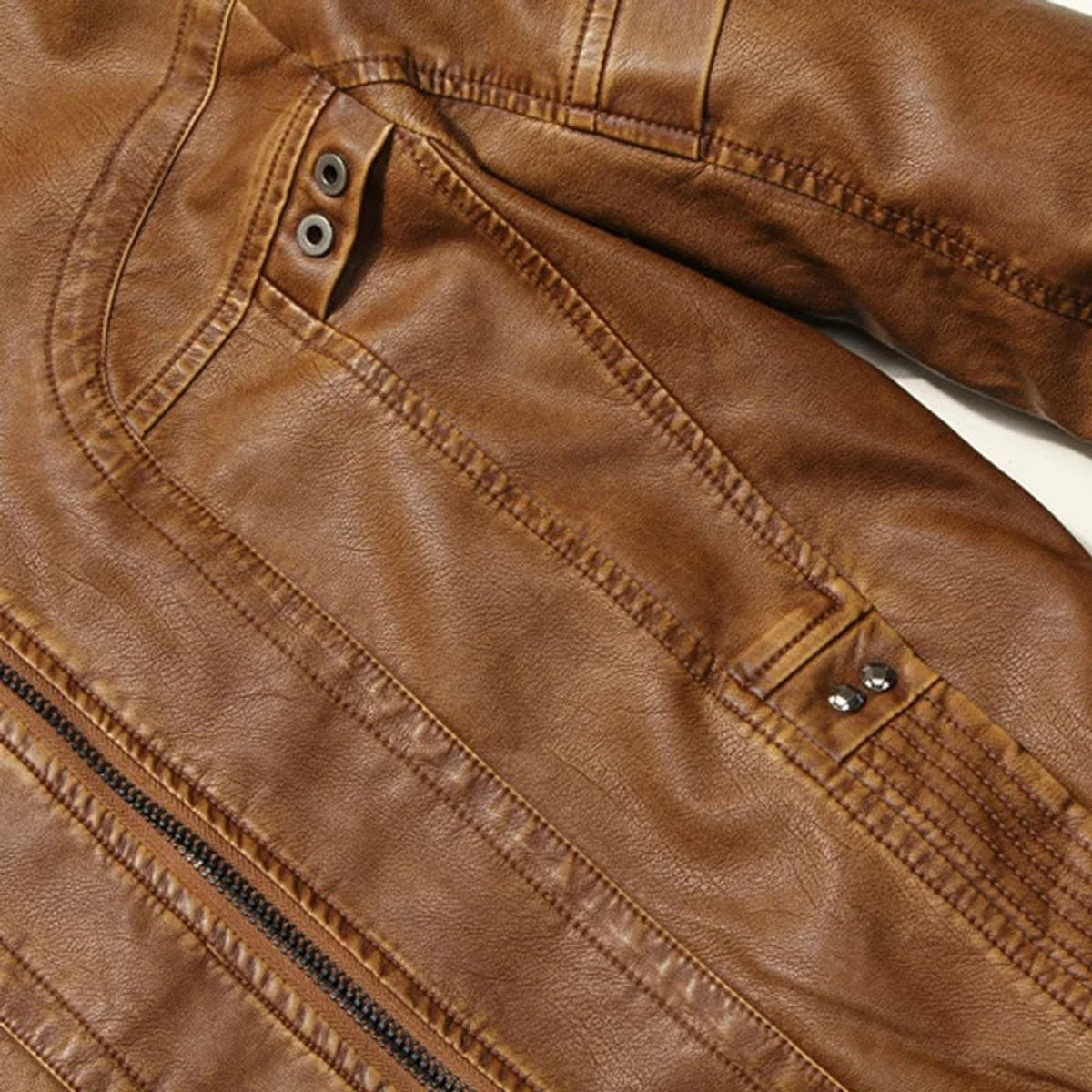 Close-up of leather jacket pocket with stud fastenings and stitching