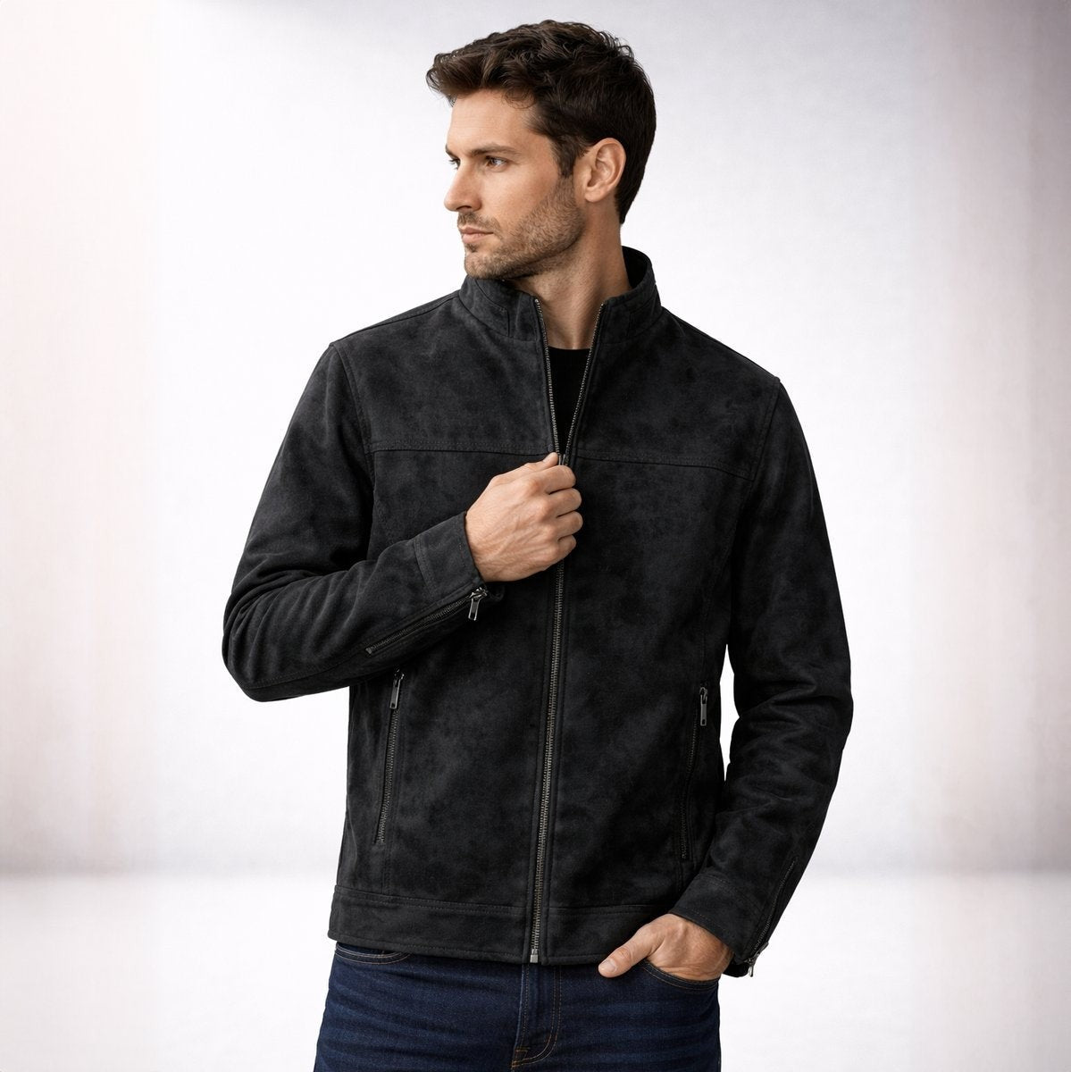 Man wearing black suede-effect bomber jacket zipped halfway up