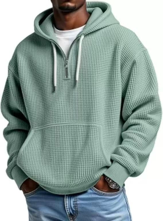 Sage green textured hoodie featuring half-zip and relaxed fit