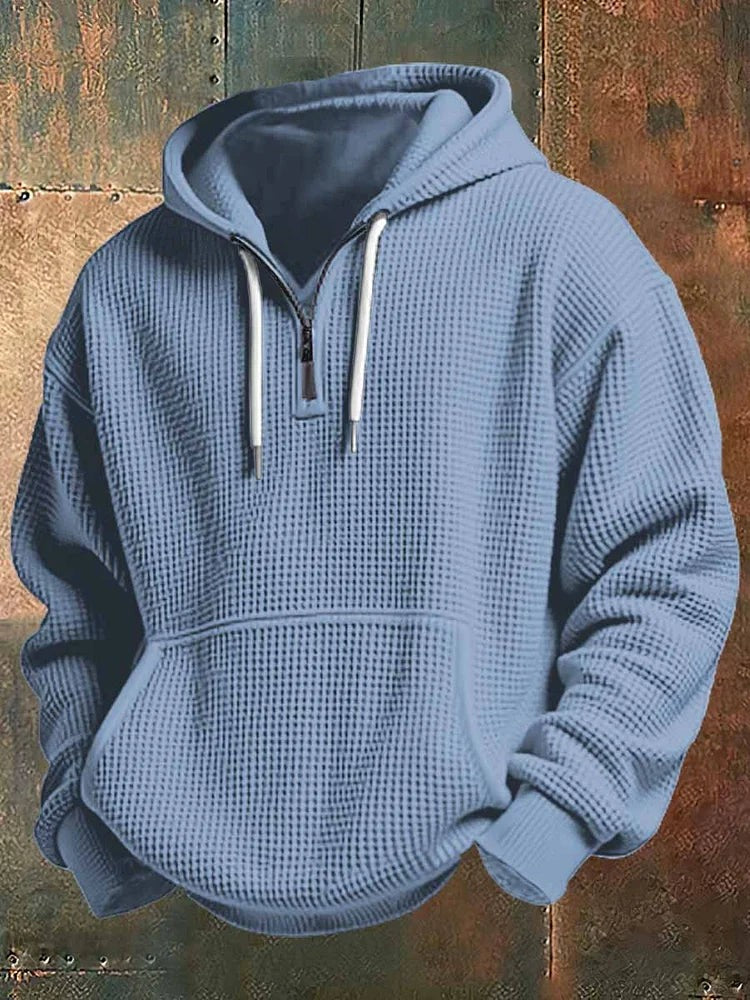 Dusty blue textured hoodie featuring half-zip neckline and kangaroo pocket
