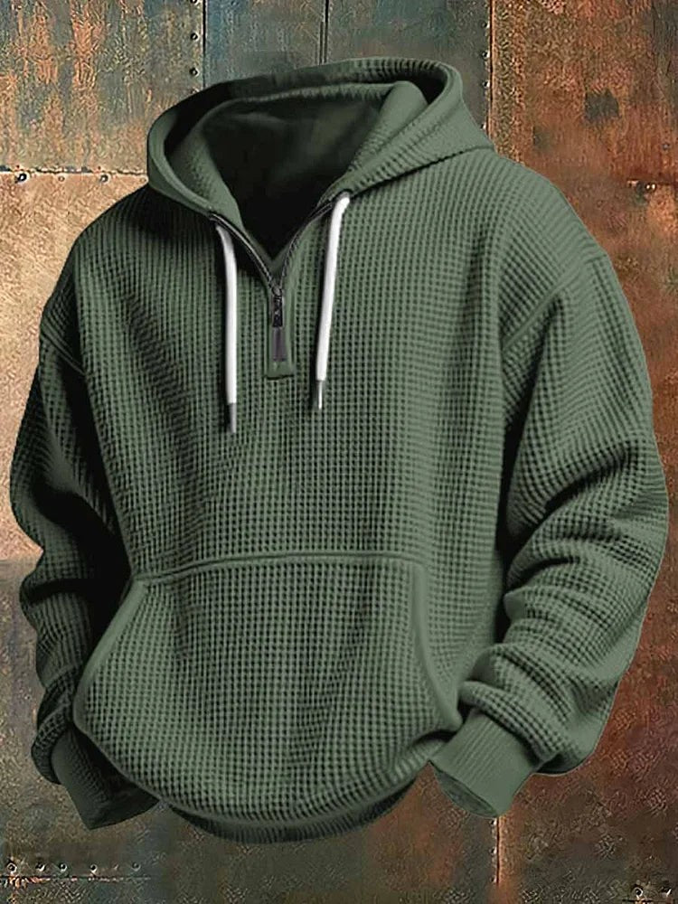 Olive green textured hoodie showing quarter-zip and front pouch pocket