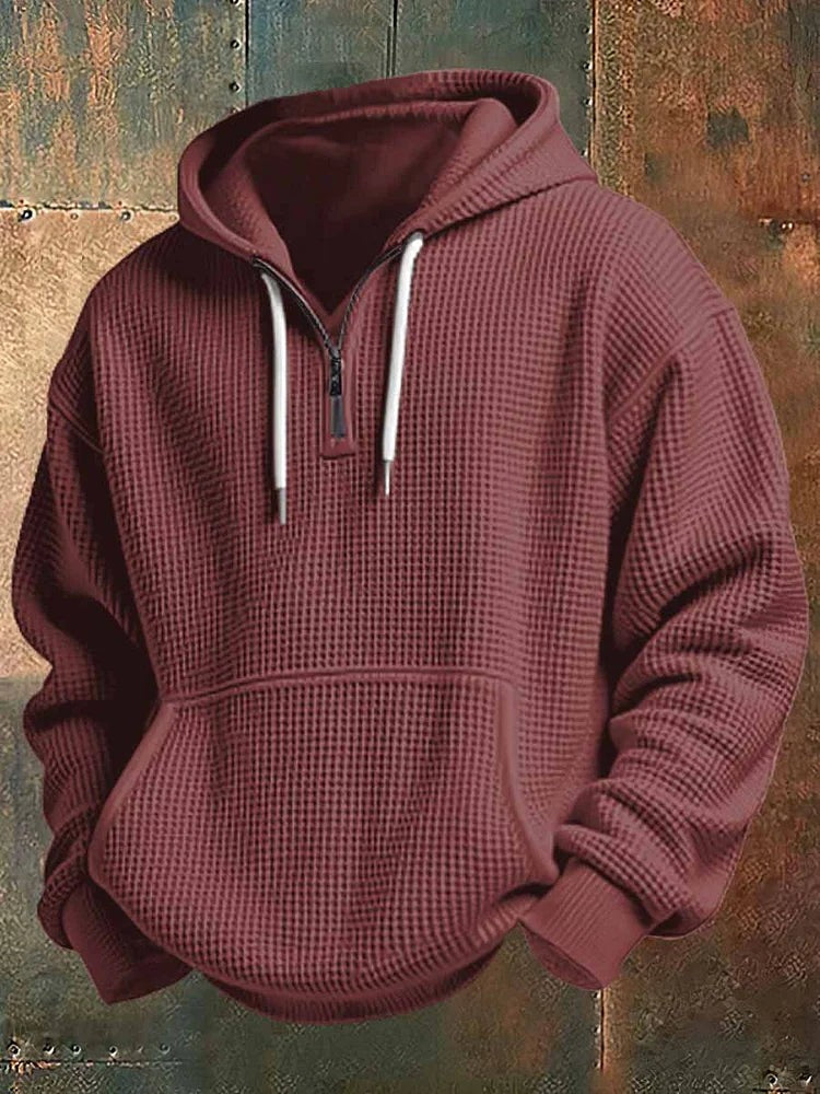 Burgundy waffle knit hoodie with white drawstrings and ribbed cuffs