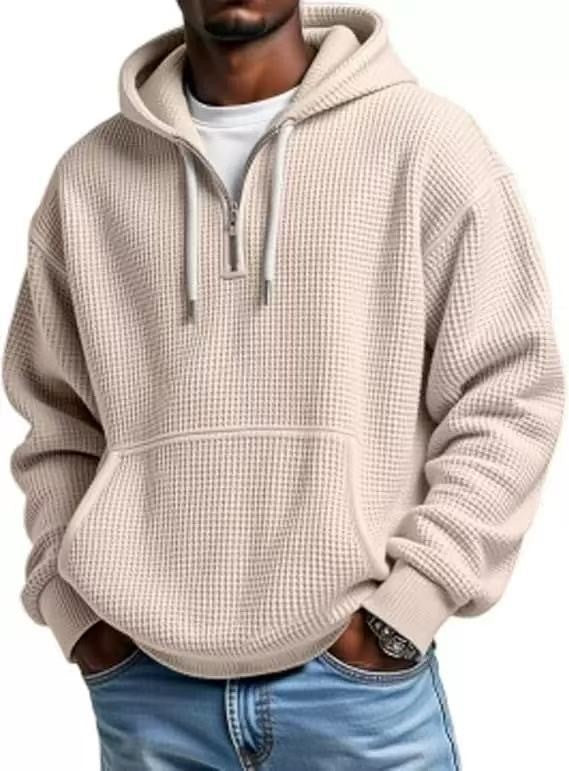 Beige waffle knit hoodie styled with quarter-zip and roomy hood