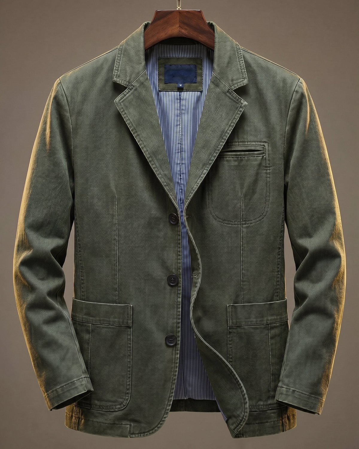 Olive green washed denim blazer with patch pockets and notched lapel