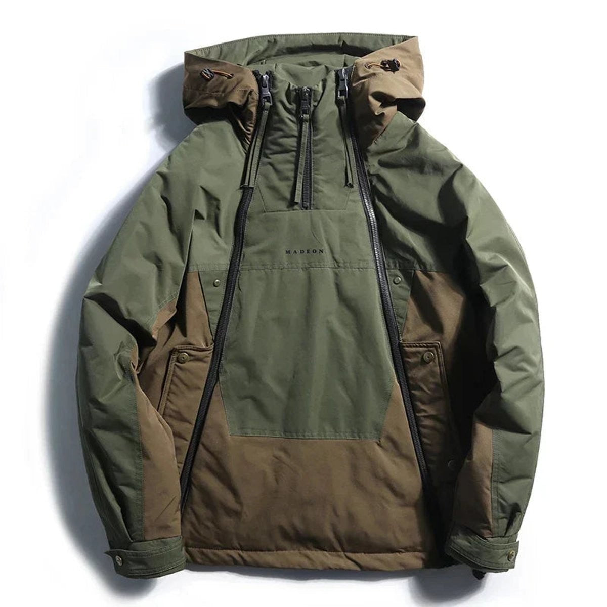 Olive and brown colour-block hooded utility jacket laid flat with popper pockets