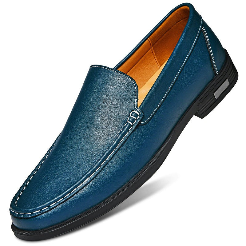Teal leather loafer featuring buckle trim and black sole