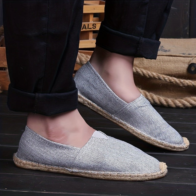 Model wearing silver-grey woven espadrille with rope sole detail