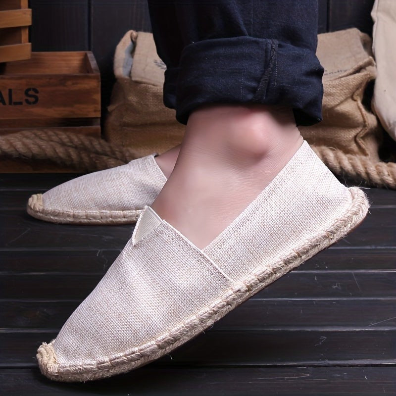 Model wearing beige linen espadrille with braided jute trim