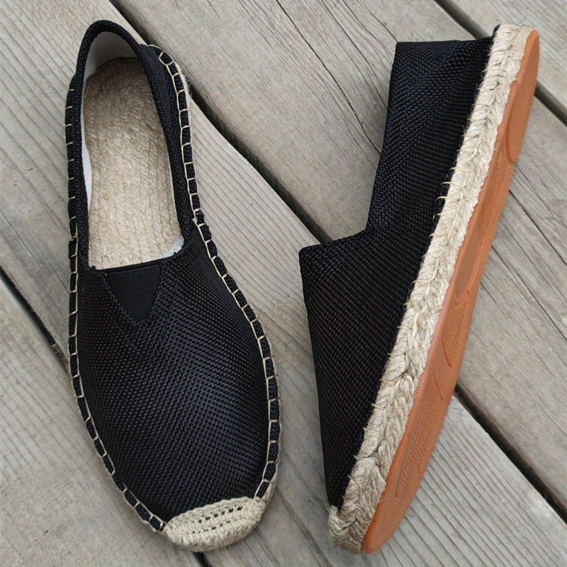 Black mesh espadrilles with jute edging and tan rubber sole